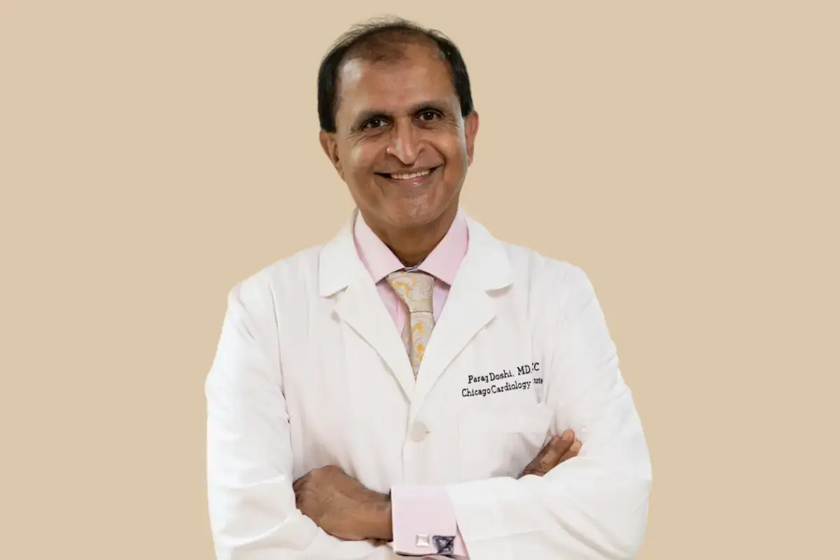 Dr. Doshi of the Chicago Cardiology Institute, smiling with Arms Crossed